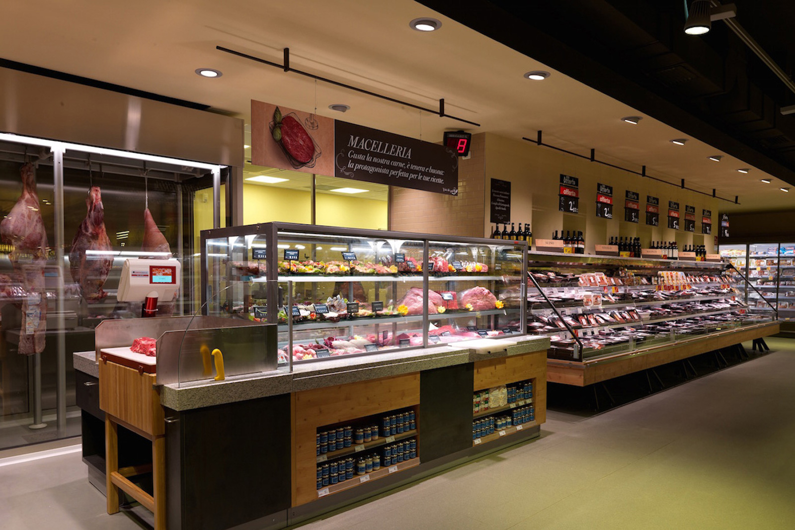 Ristrutturazione e rifacimento layout carrefour market su modello gourmet c.so Colombo Torino Traumfabrik studio associato Milano